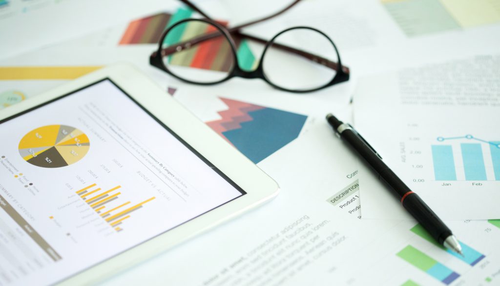 This is a photo of various financial charts on a desk