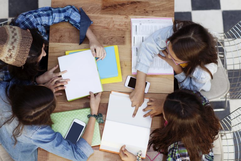 Photo of a happy group of students studying.