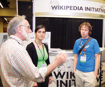 Robert Kraut (left) and Rosta Farzan (middle) from Carnegie Mellon University, along with Sage Ross (right) from the Wikimedia Foundation, discuss how the APS Wikipedia Initiative (APSWI) can help teachers incorporate Wikipedia into class assignments. Several demonstrations at the APS Convention showed faculty and students how to get involved in APSWI. 