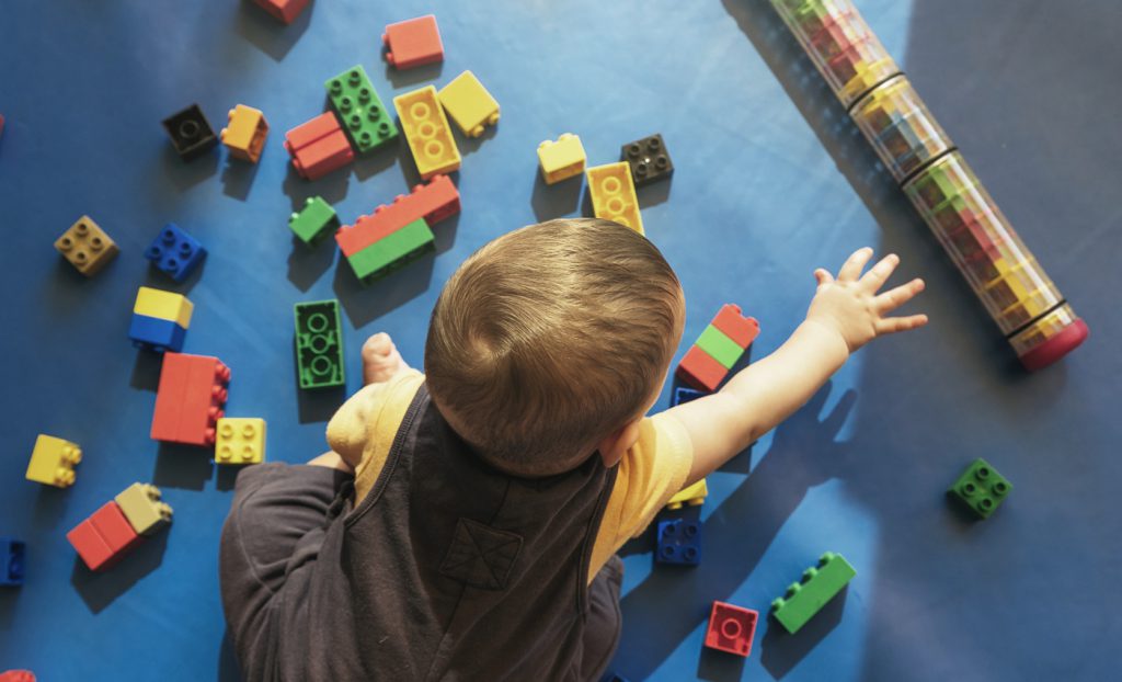 Baby playing with toy blocks