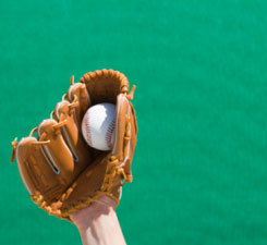 This is a photo of a baseball in a baseball mit.
