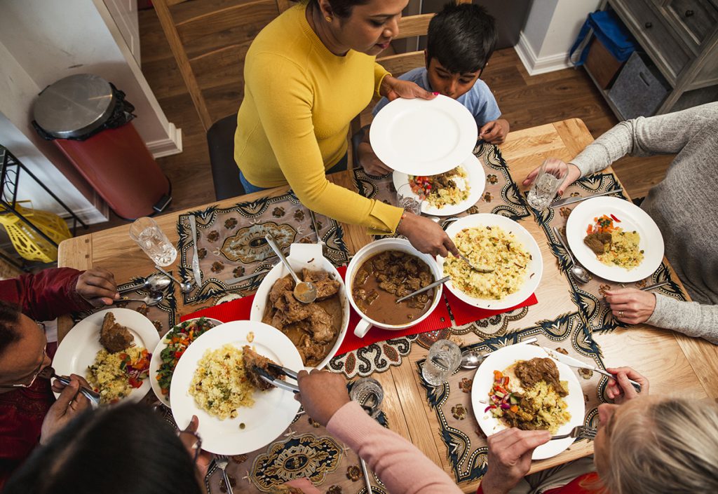 This is a photo of a family eating dinner