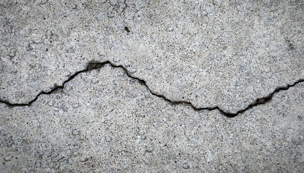 A crack runs across a cement floor