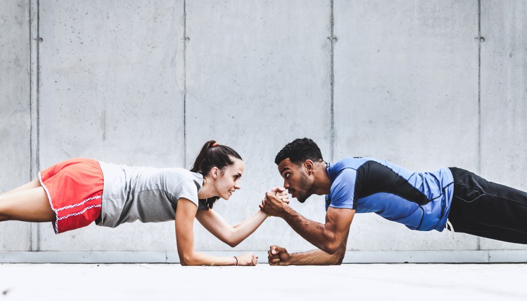 Two friends exercising together