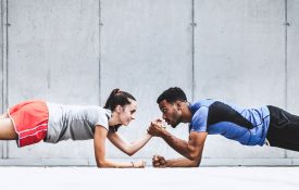 Two friends exercising together