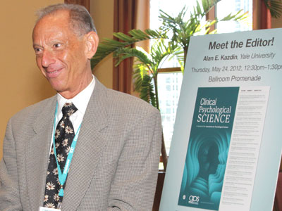 <i>Clinical Psychological Science</i> Founding Editor Alan E. Kazdin waits to greet a crowd of attendees who are excited about the new journal.