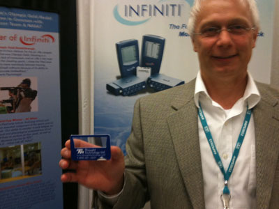 This is a photo of a man holding a blue magnifier.