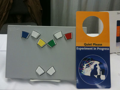This is a photo of a door hanger that reads, "Quiet Please, Experiment in Progress."