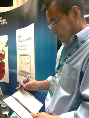 This is a photo of a man holding a journal.