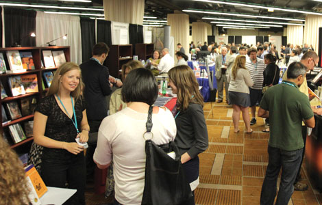 Attendees gather in a packed Exhibit Hall where 35 exhibitors were waiting to show them the latest in psychological science books, gear, and equipment.