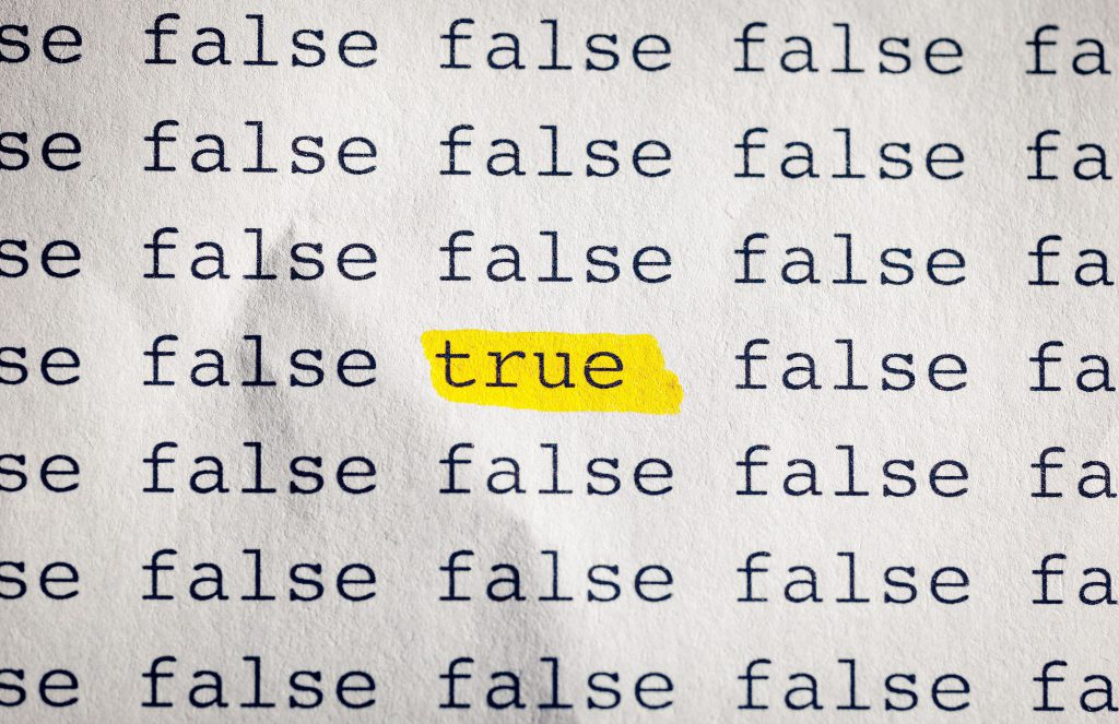 This is a photo of the word "true" highlighted in yellow.