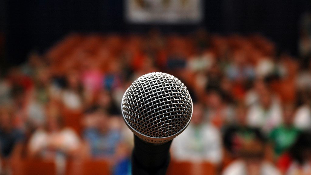 A microphone in front of an audience