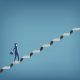 Businesswoman walking up staircase.