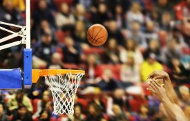 Scoring the winning points at a basketball game , motion blur