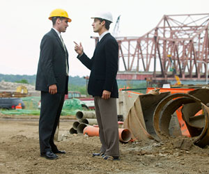 Two businessmen arguing on a construction site.