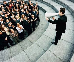 This is a photo of a CEO speaking to his employees through a megaphone.