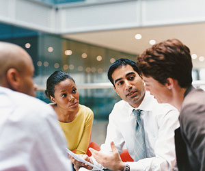 This is a photo of a group of colleagues in a discussion.