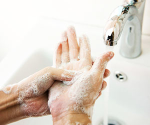 This is a photo of a person washing his hands.