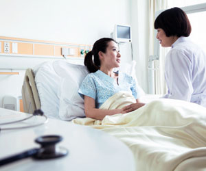 This is a photo of a doctor talking with her patient.