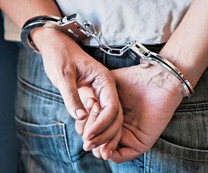 This is a photo of a man's hands in handcuffs.