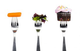This is a photo showing forks with different food options