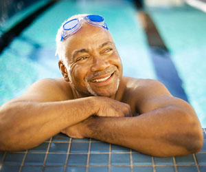 This is a photo of an older man in a swimming pool.