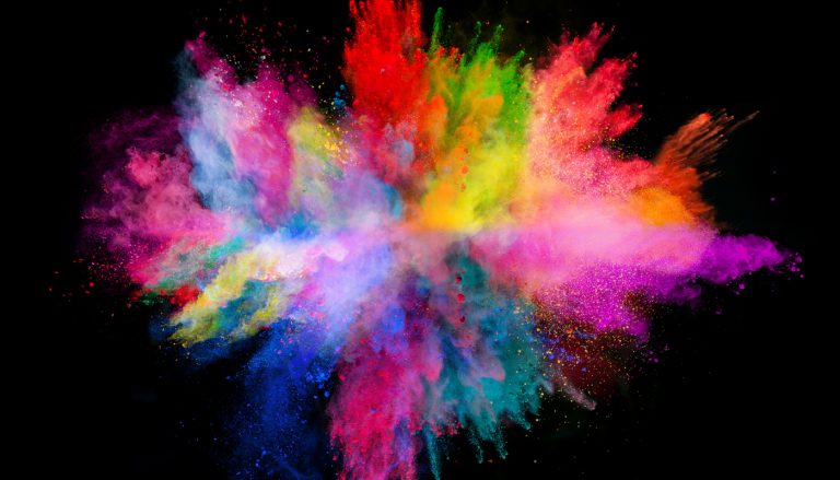 Explosion of colored powder, isolated on black background