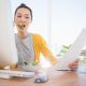Businesswoman eating a salad while working