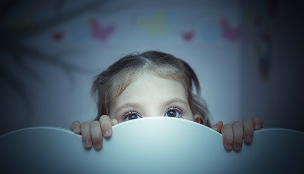 little girl is afraid of shadow