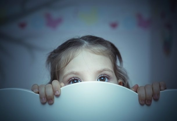 little girl is afraid of shadow