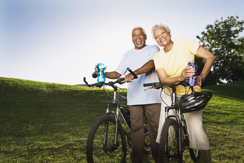 Smiling senior couple with mountain bikes