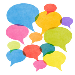 A set of abstract watercolor textured speech bubbles in various sizes and colors all overlapping symbolizing gossip, social media networking and conversation.