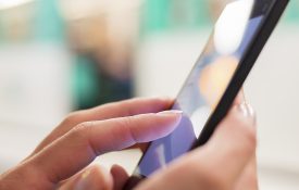 Here is a picture of someone using a mobile device