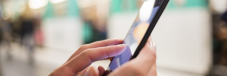 Here is a picture of someone using a mobile device