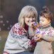 Grandmother and granddaughter blowing bubbles