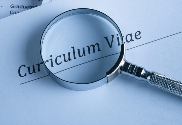 A curriculum vital and a magnifying glass