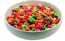 A picture of a bowl of fruity cereal.