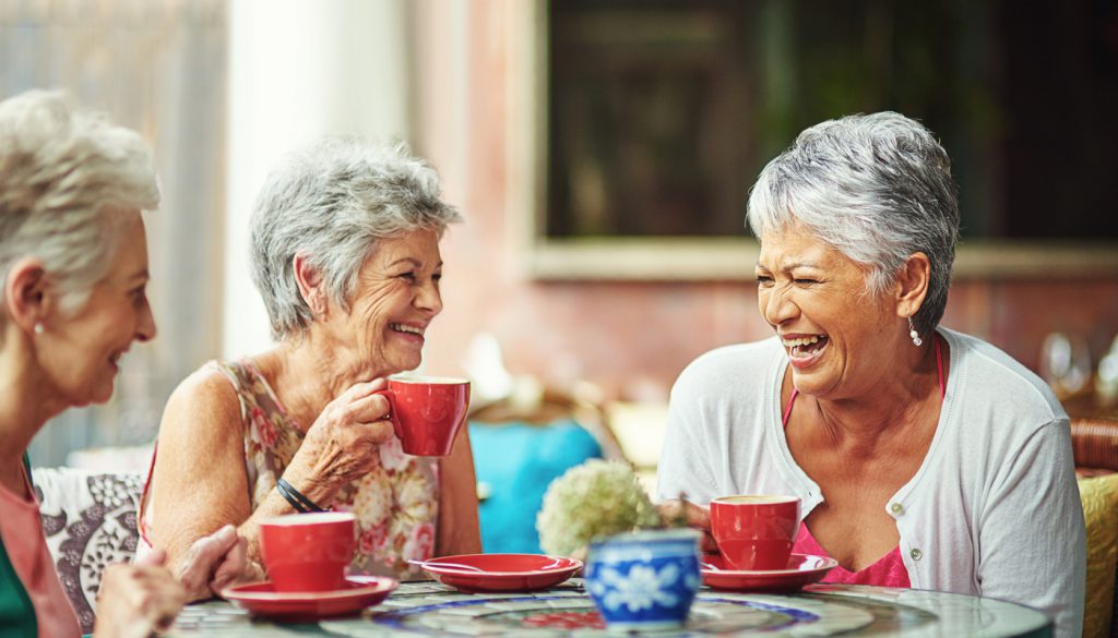 Shot of a group of elderly friends having coffee together