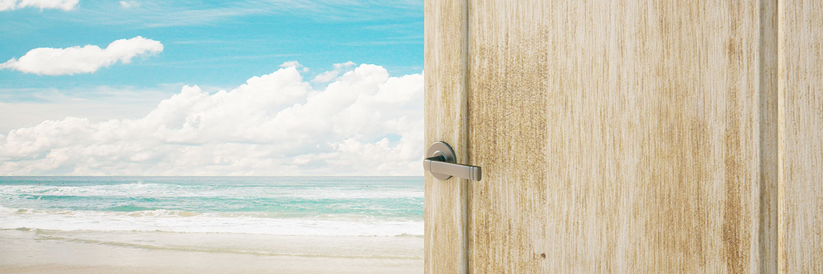 This is a photo of a door opening to a beach.