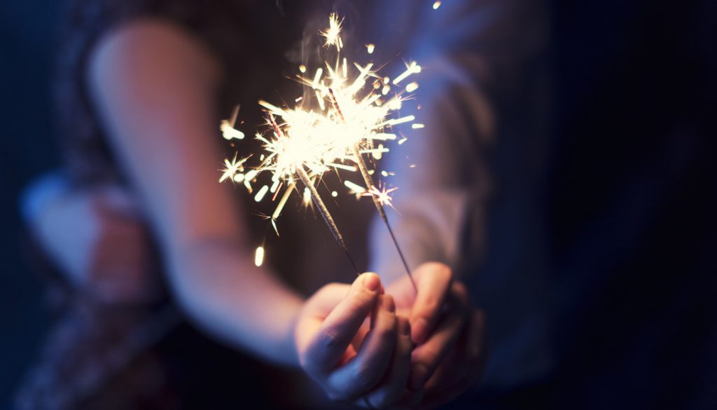 This is a photo of a couple holding sparklers