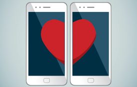 This is an illustration showing two phones with matching heart halves.