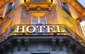 Illuminated hotel sign taken in Paris at night