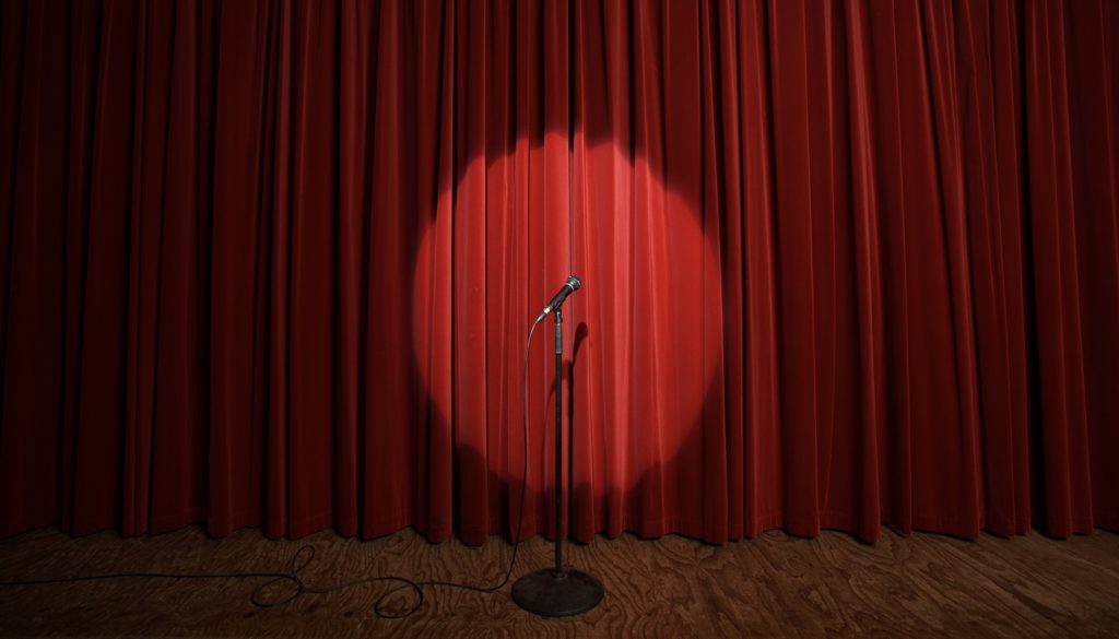 Spotlight on microphone stand on stage