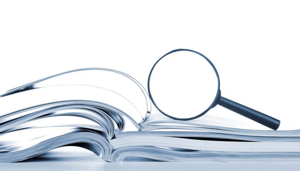 This is a photo of a magnifying glass on top of open books