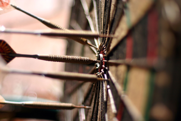 This is a photo of a dartboard with darts.