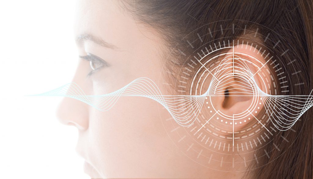Profile of a woman with sound waves