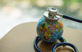 This is a photo of a stethoscope on a globe.