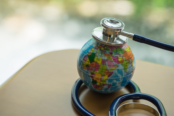 This is a photo of a stethoscope on a globe.