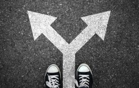This is an illustration of a person choosing between two paths