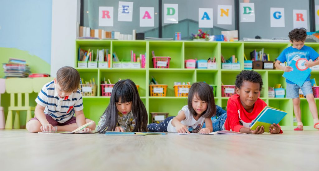 This is a photo of kids reading books in a classroom